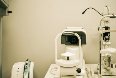 a microscope sitting on top of a table next to a camera
